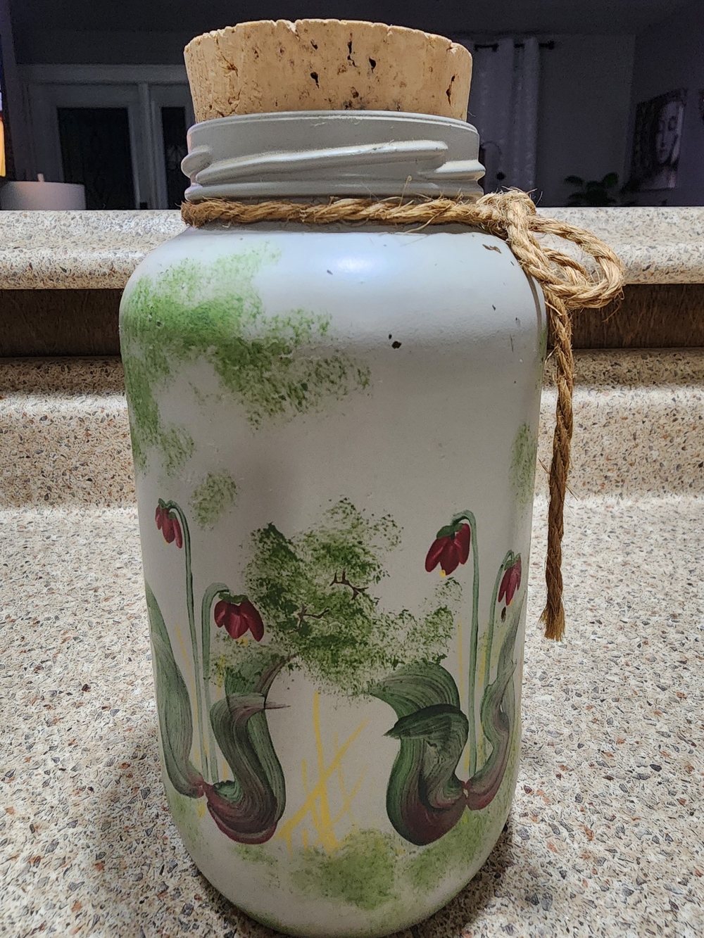 House Decorative glass rustic floral design and a cork stopper.
